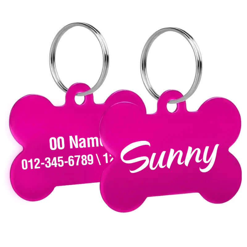 Custom engraved bone-shaped dog tags with clear text engraving